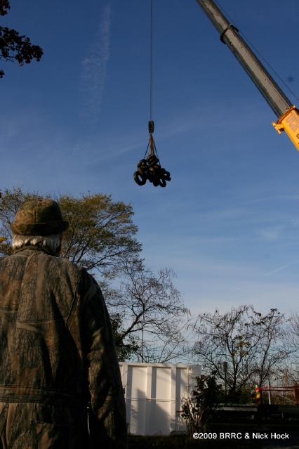 George Malone awaits the arrival of the first set of tires that he and over 200 volenteers have pulled from the mud. 