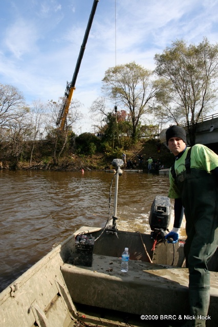 Brian Schilpp navigates his way back from the crane dump site to the westernbank for another load of trash..